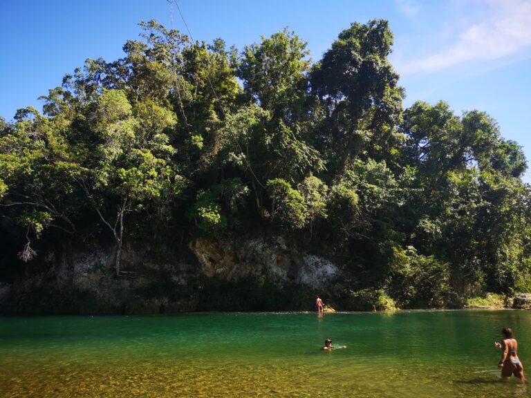 people swimming crystal green water jamao river cabarete