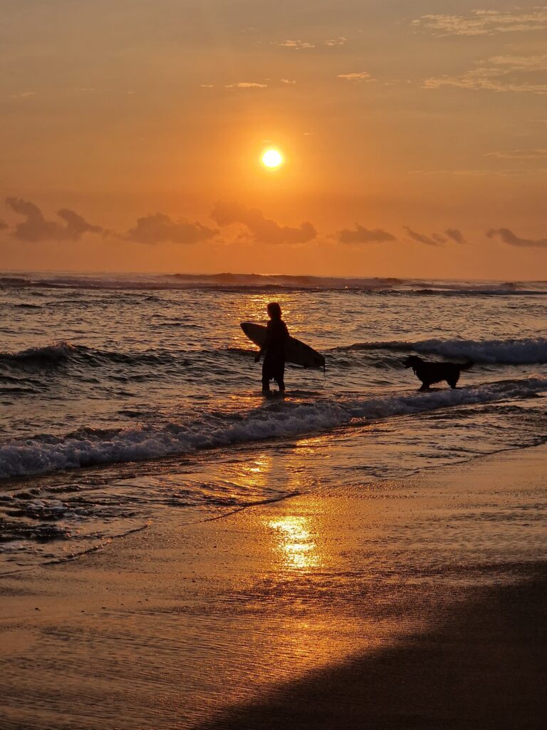 person silhouette beach sunrise reflection cabarete