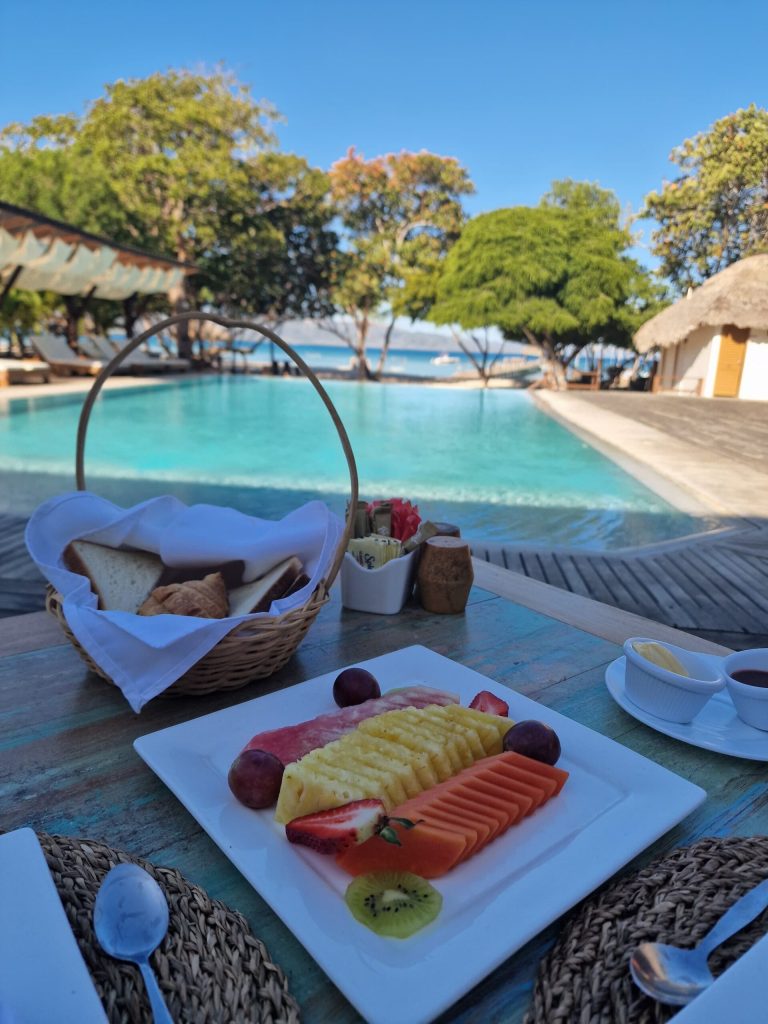 breakfast tropical fruits bread basket pool punta rucia lodge