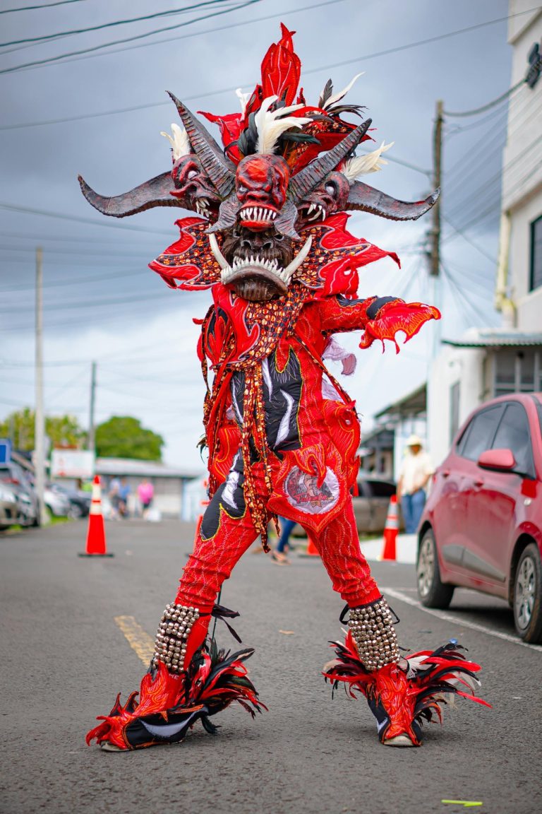 carnival performer red costume parade la vega