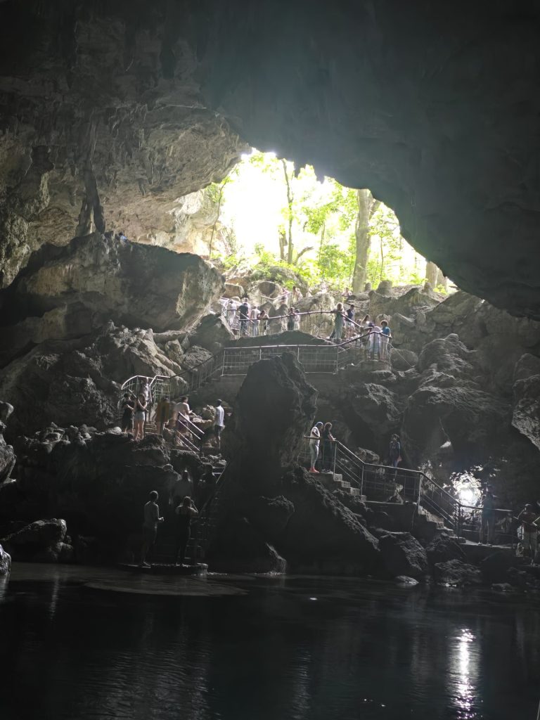 cave interior metal stairs visitors light shaft santo domingo