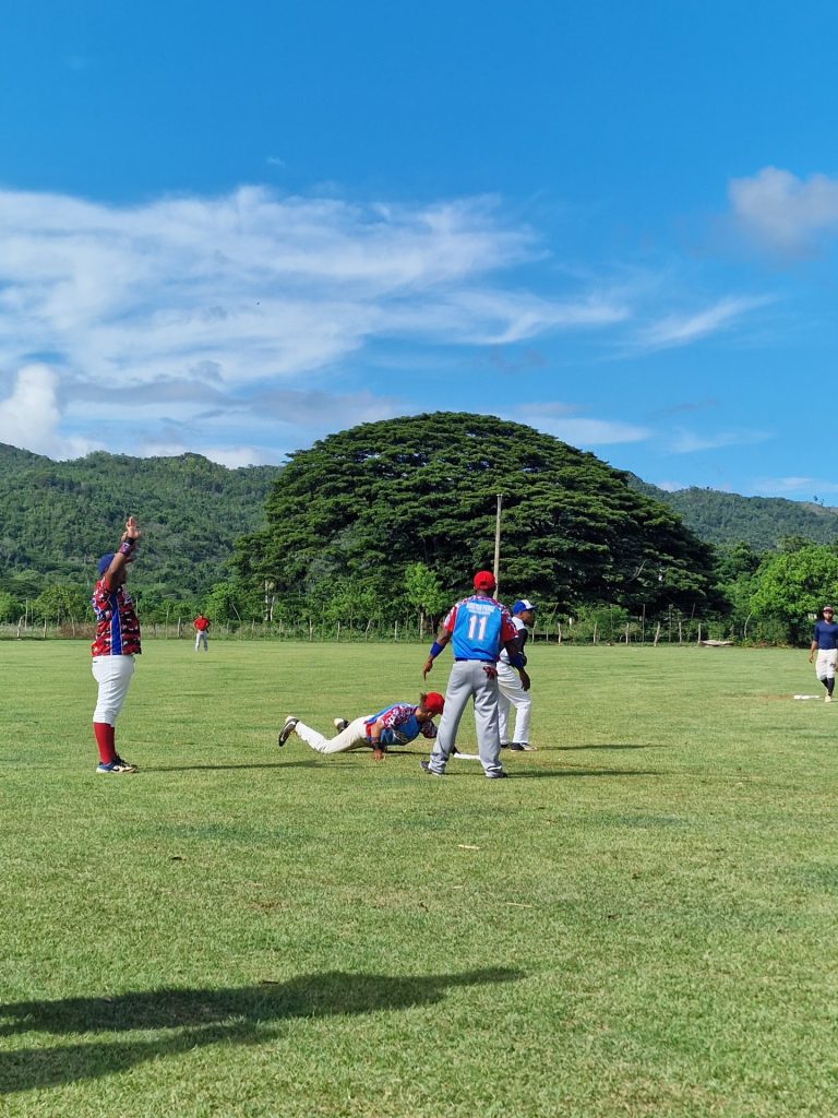 dominican baseball players action mountain backdrop bonao