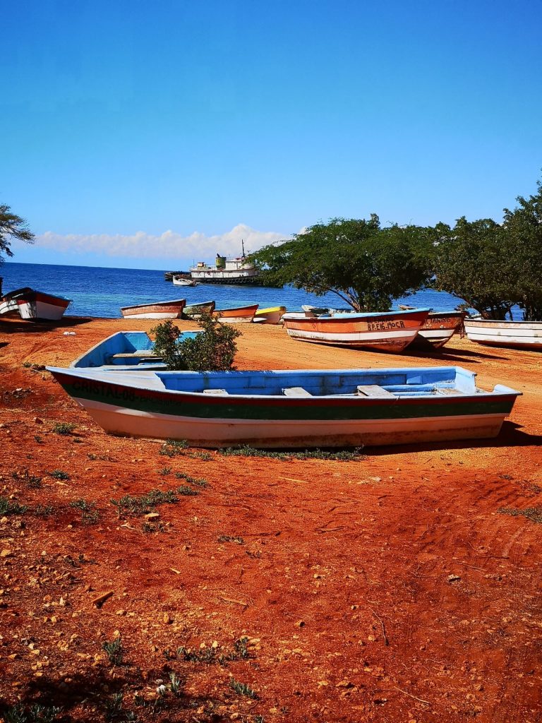 fishing boats red earth shoreline southwest