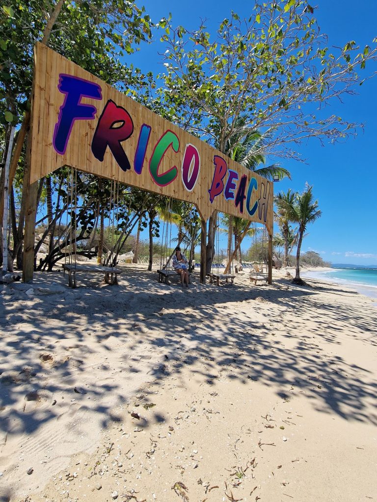 frico beach colourful wooden sign palms punta rucia