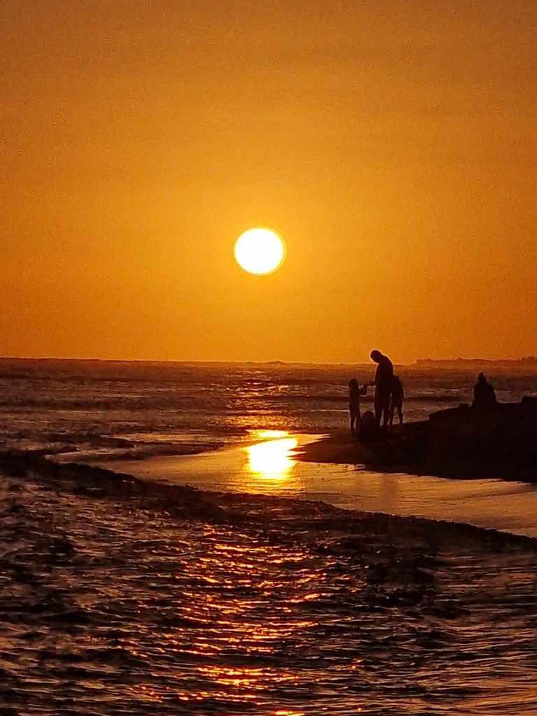 juan dolio sunset beach crowd silhouettes south coast