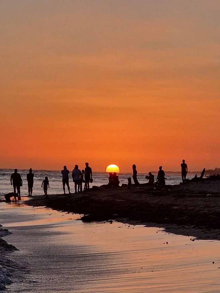 juan dolio sunset beach people walking silhouettes south coast