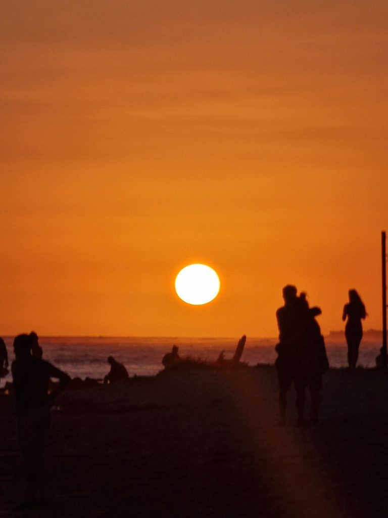 juan dolio sunset beach two people silhouettes south coast