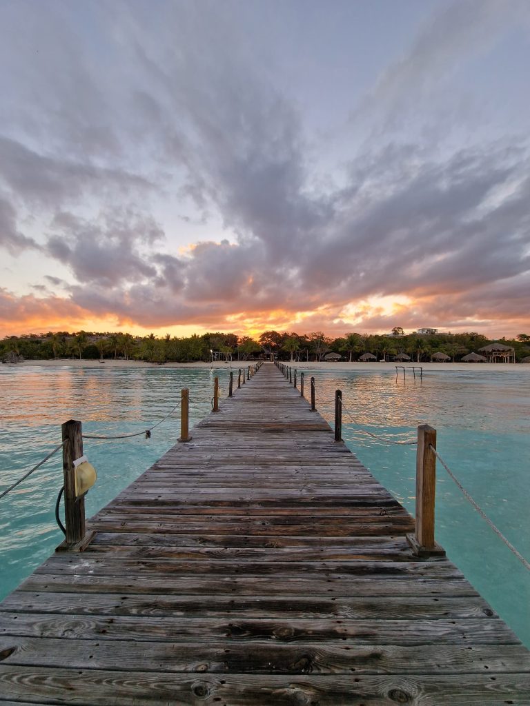 long pier dawn dramatic cloudy sky punta rucia lodge