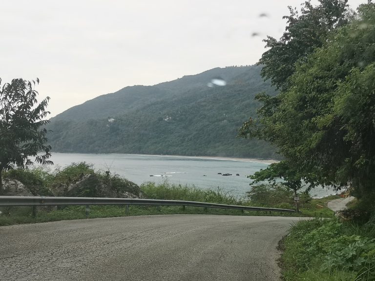 mountain coast road bay view lush hillside southwest
