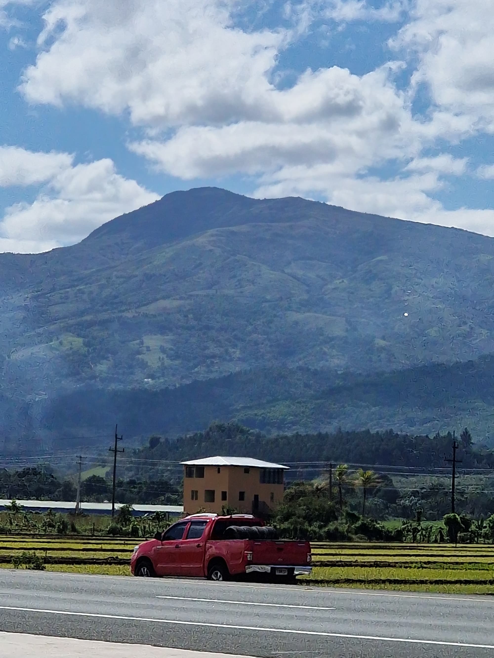 Road through the Dominican Republic with a mountain valley view
