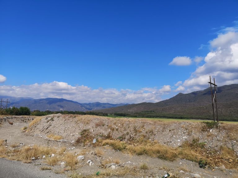 open flat valley dry gravel mountains southwest