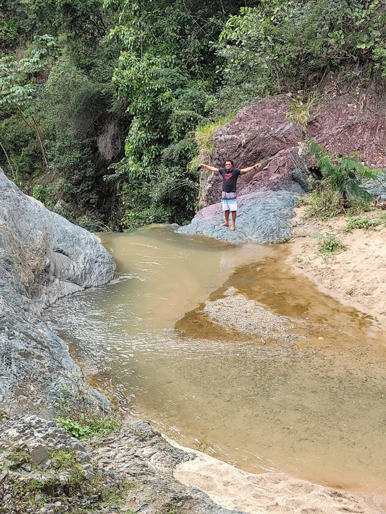 person rocky river gorge cliff yaque del norte jarabacoa