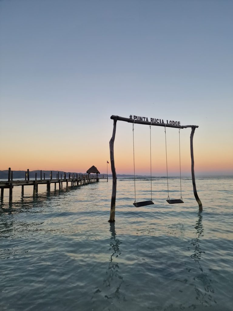 punta rucia lodge pier sign arch dawn punta rucia