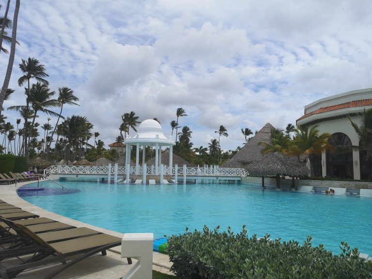resort pool white rotunda palms thatched palapas bavaro punta cana