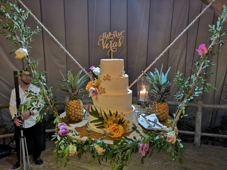 tropical wedding cake pineapples flowers greenery punta cana