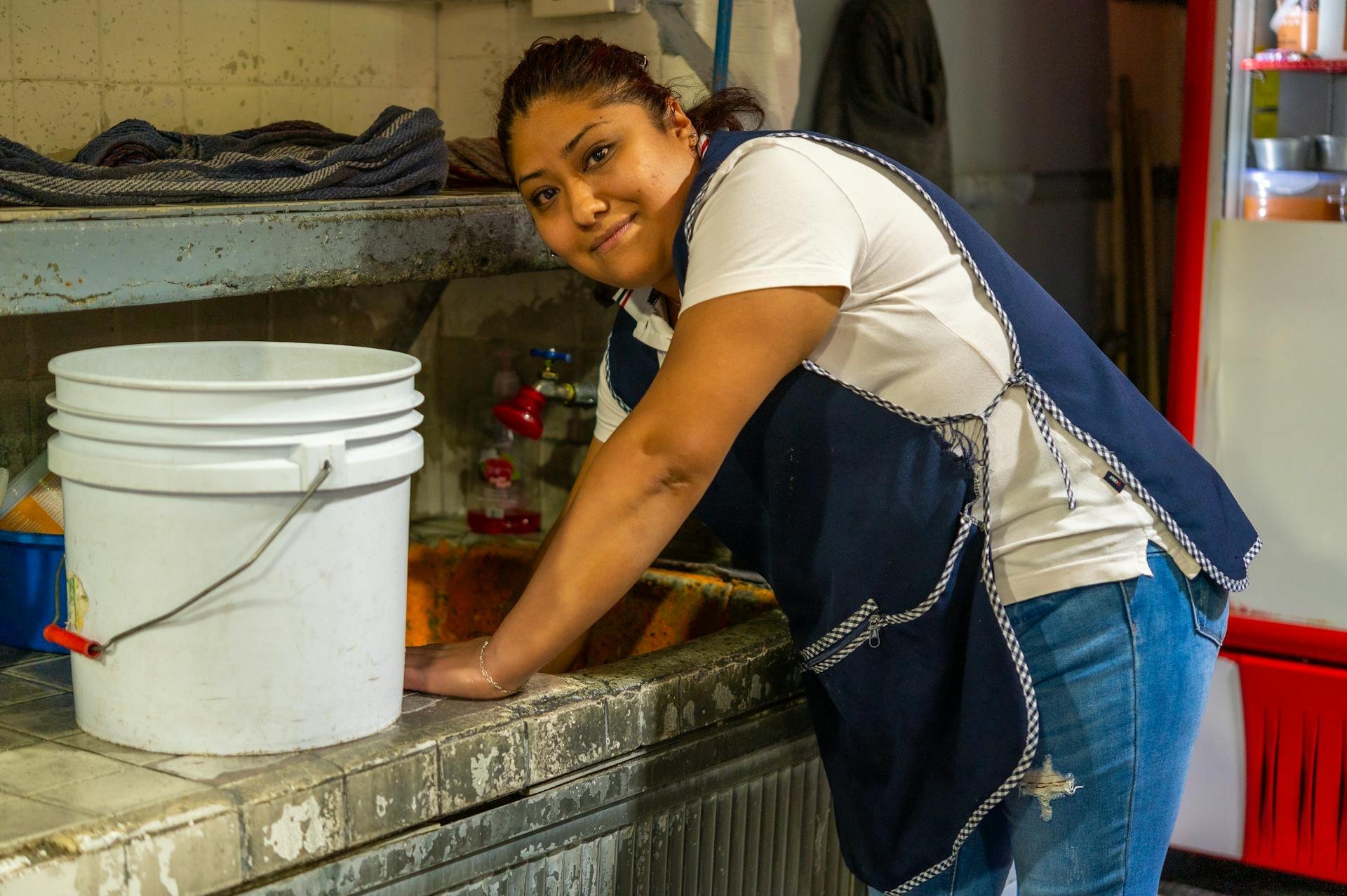 Woman cleaning a kitchen, domestic help in the Dominican Republic